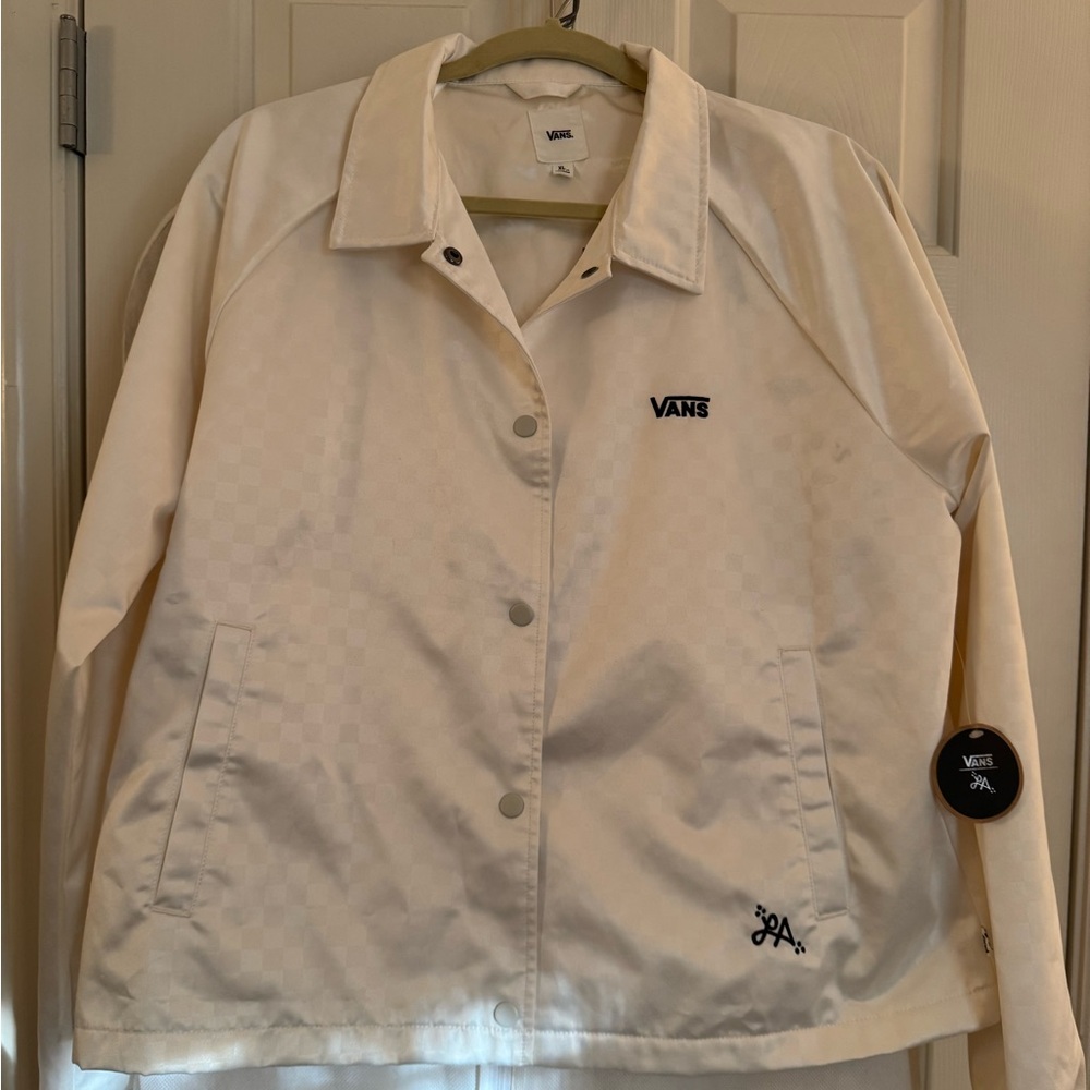 Vans Women's Off-White/Cream Snap-Up Jacket with side pockets.